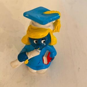 Smurfette graduating in cap and gown